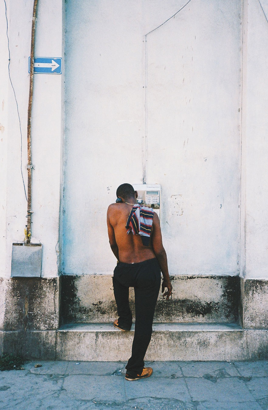 Man on pay phone in Havana, Cuba